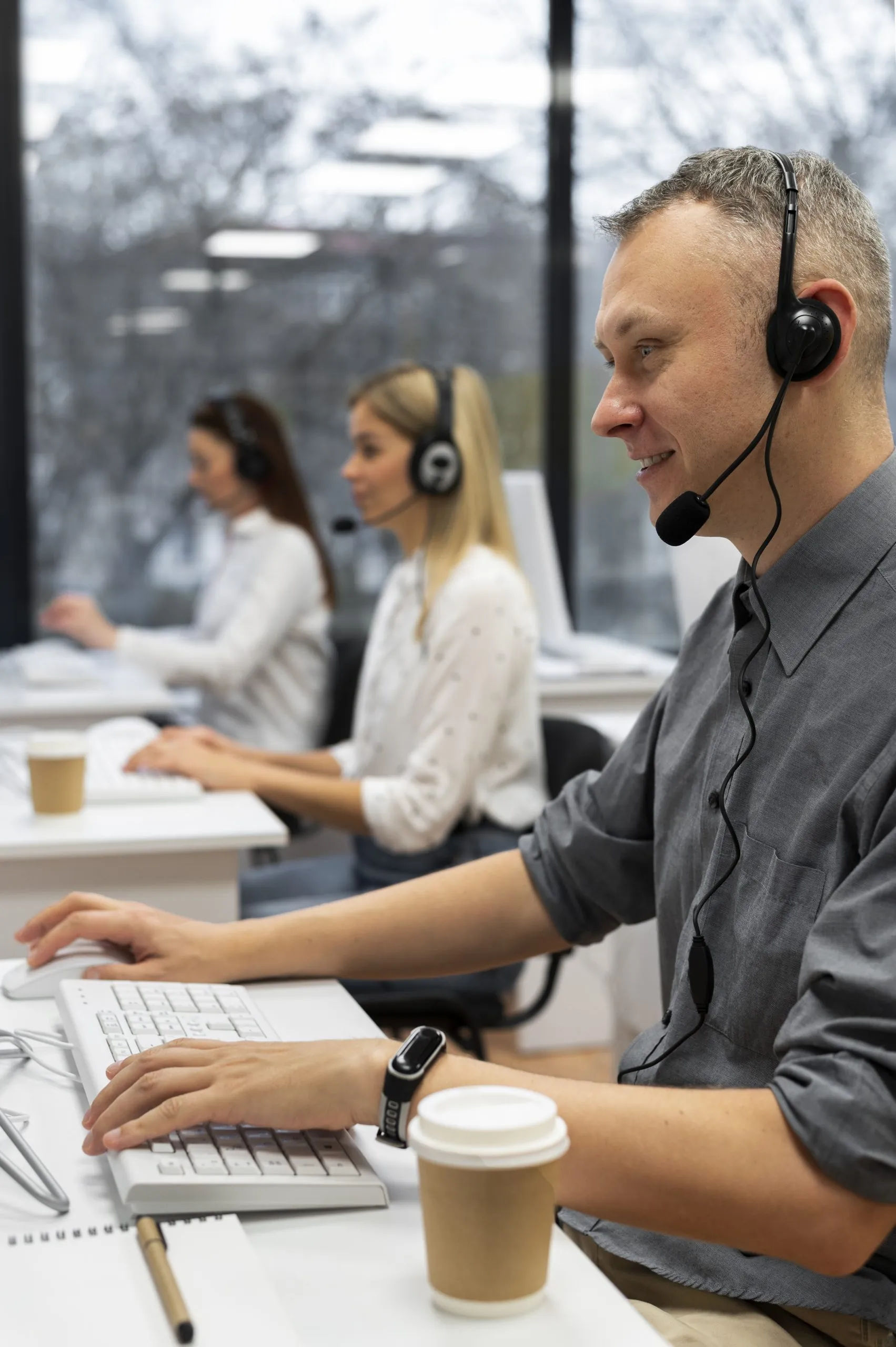 Office staff using a hosted PBX phone system